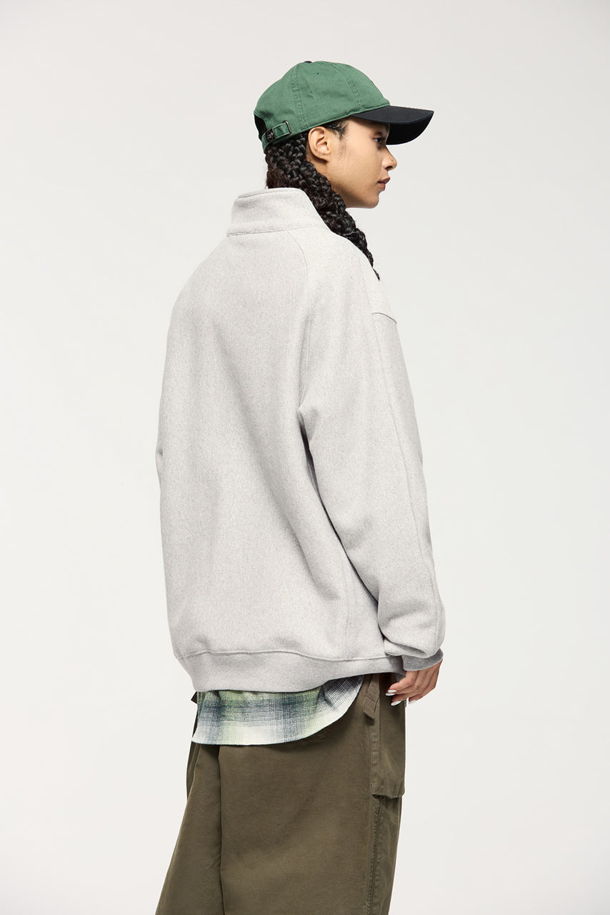 Sudadera con capucha y media cremallera