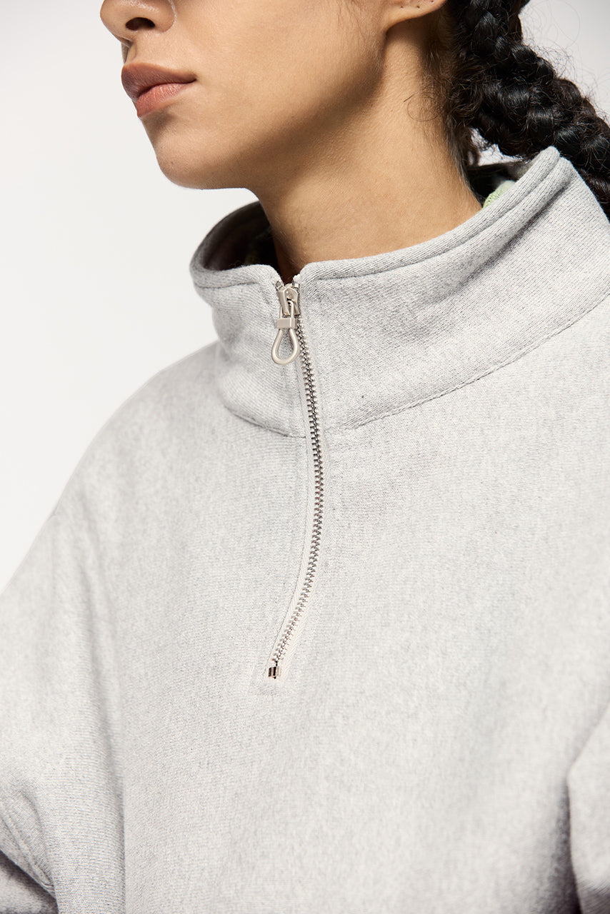 Sudadera con capucha y media cremallera