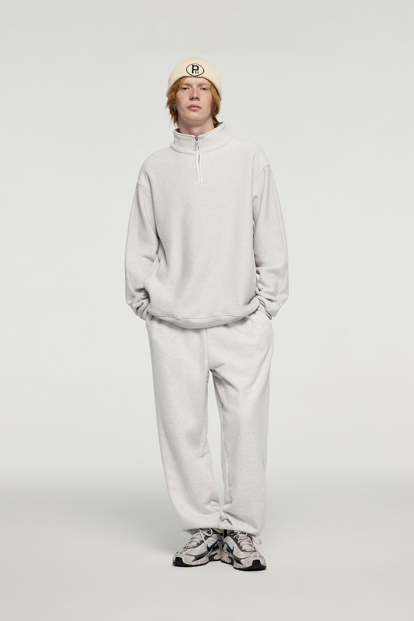 Sudadera con capucha y media cremallera