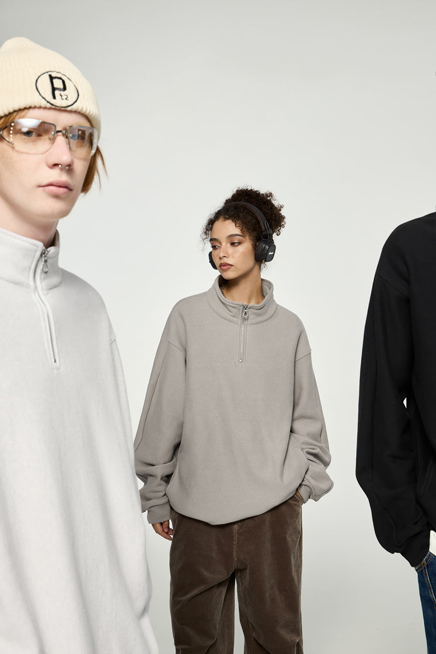 Sudadera con capucha y media cremallera