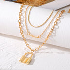【29】Cross & Lock Tiered Gold Chain Set